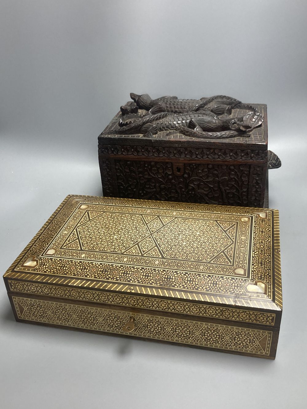 A Middle-Eastern mosaic box inlaid in bone and mother of pearl, 31.5cm and a carved padouk box, 27cm